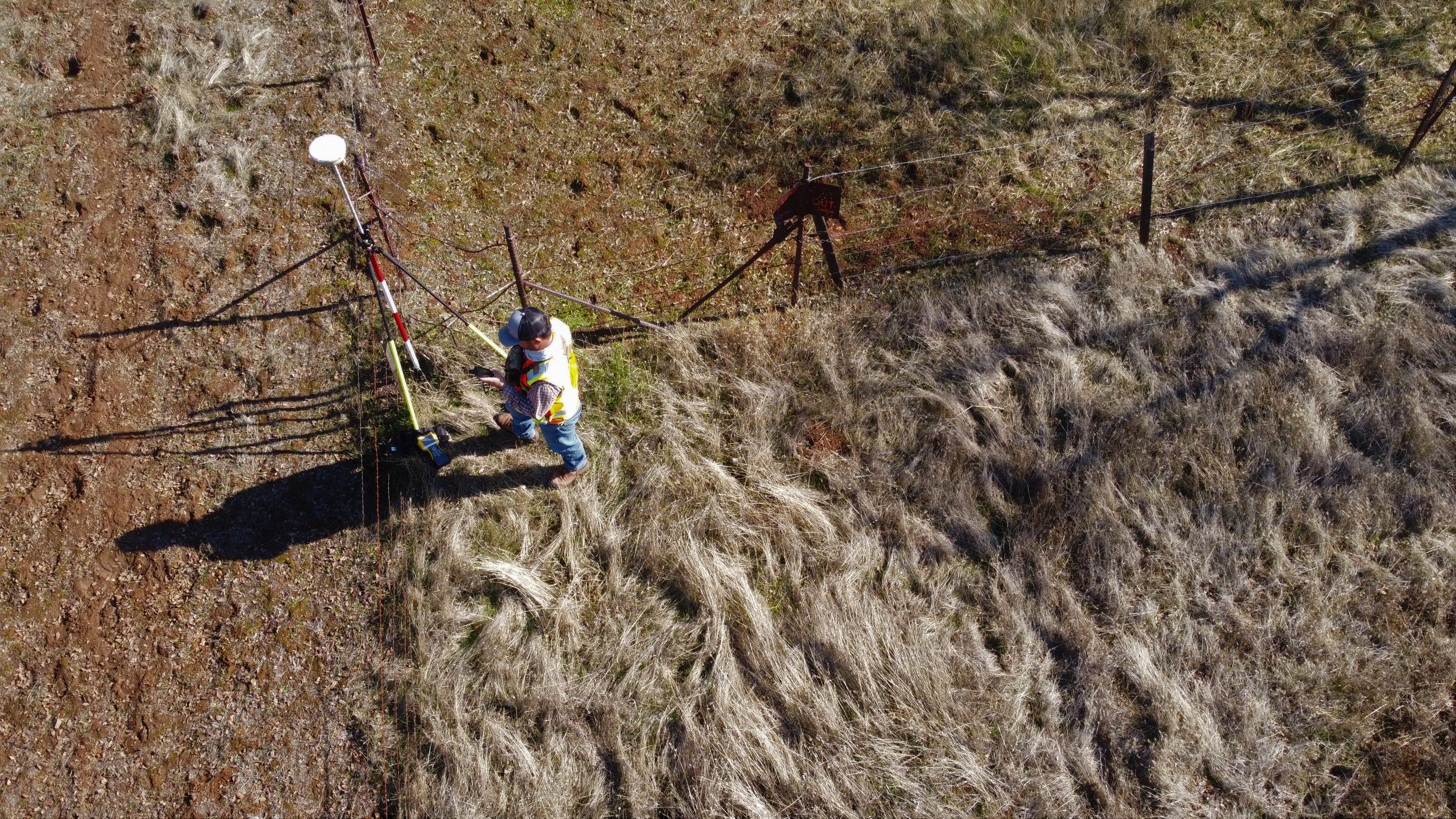 Man Surveying in Field